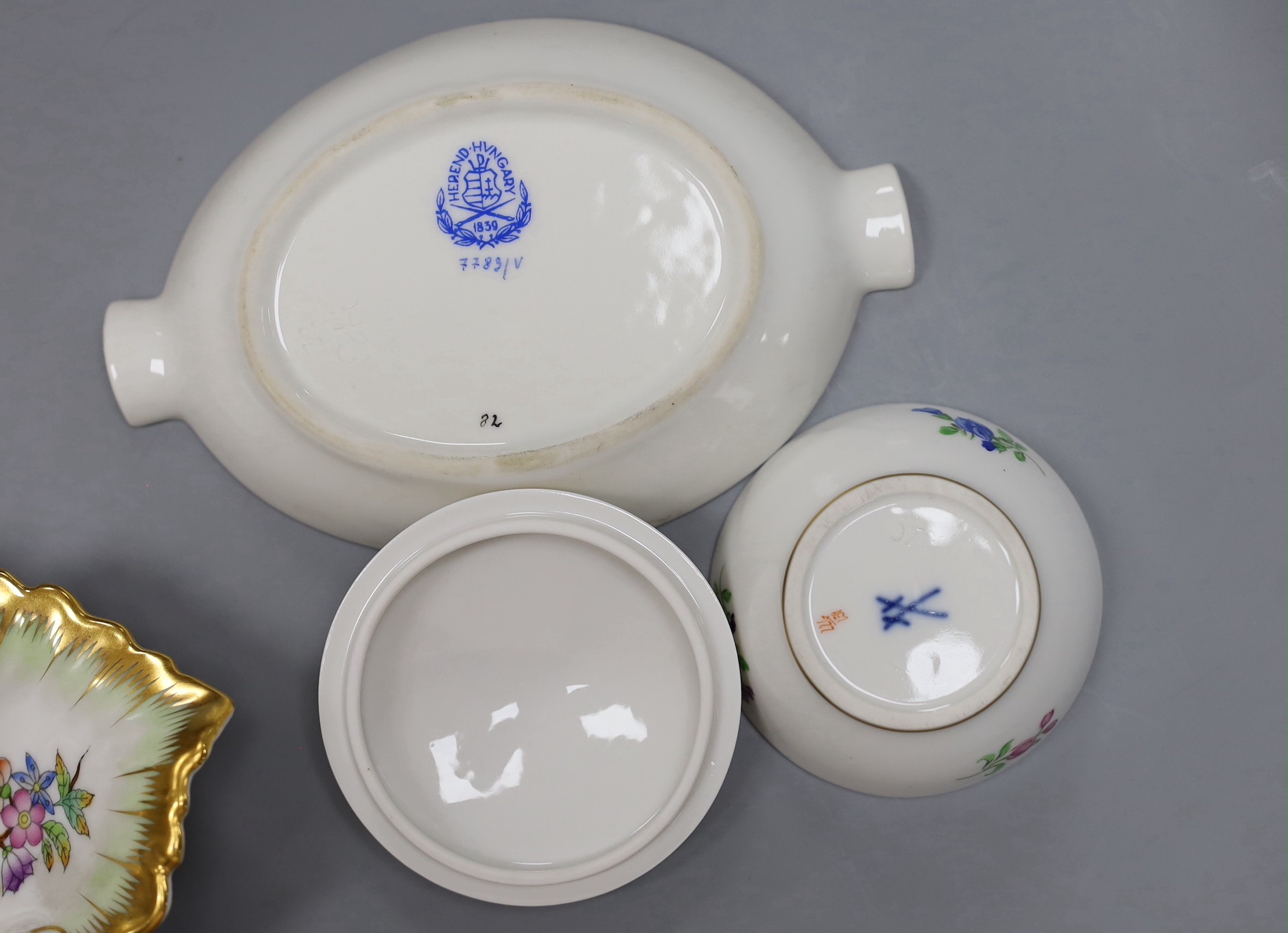 Two Meissen boxes with covers and a dish, two Herend dishes and an enamel on copper scent bottle